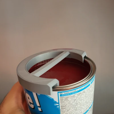 Dụng cụ gạt cọ sơn cho lon sơn