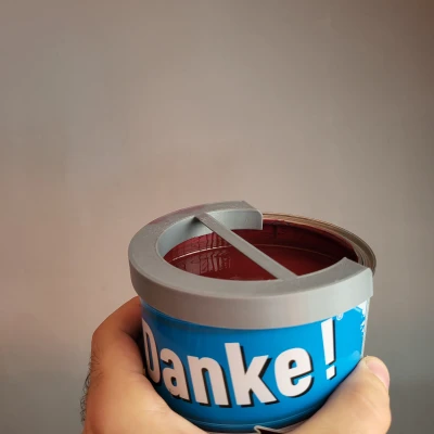 Dụng cụ gạt cọ sơn cho lon sơn