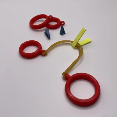 Fingerzwille - Đồ chơi bắn dây thun thời đi học