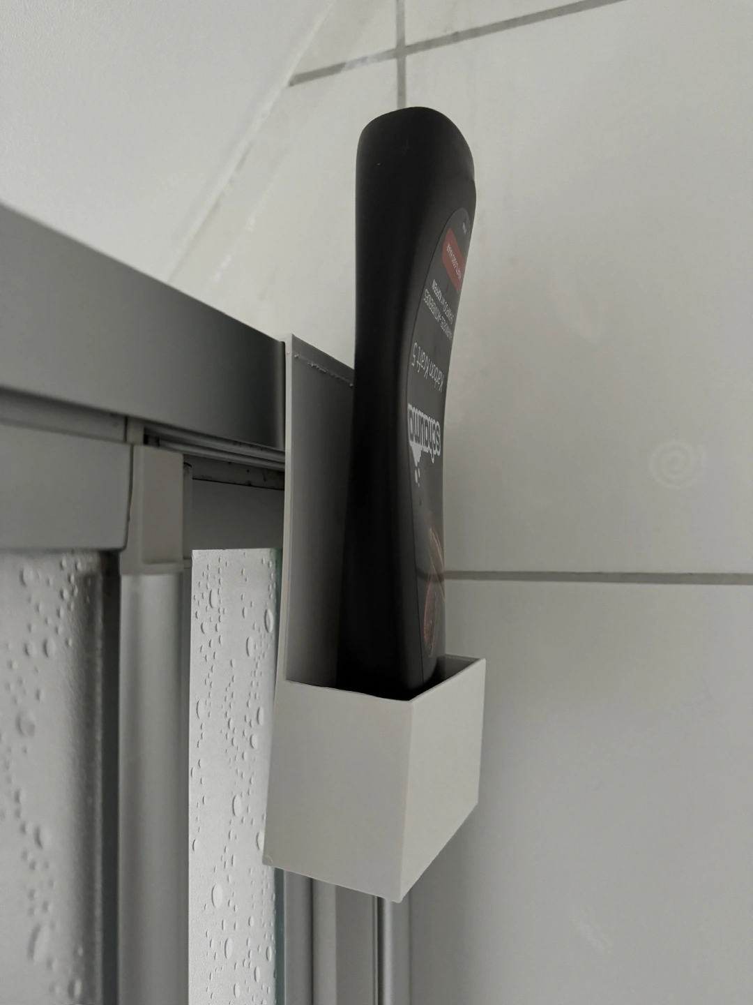 Người giữ chai dầu gội