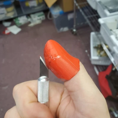 Chụp ngón tay cái Xacto