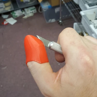 Chụp ngón tay cái Xacto