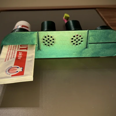 Kệ cho kem đánh răng và bàn chải đánh răng.