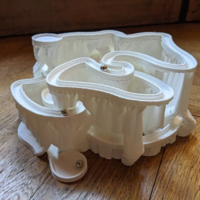 Máng bi chạy chậm dùng với cấu trúc hỗ trợ dạng cây tự động