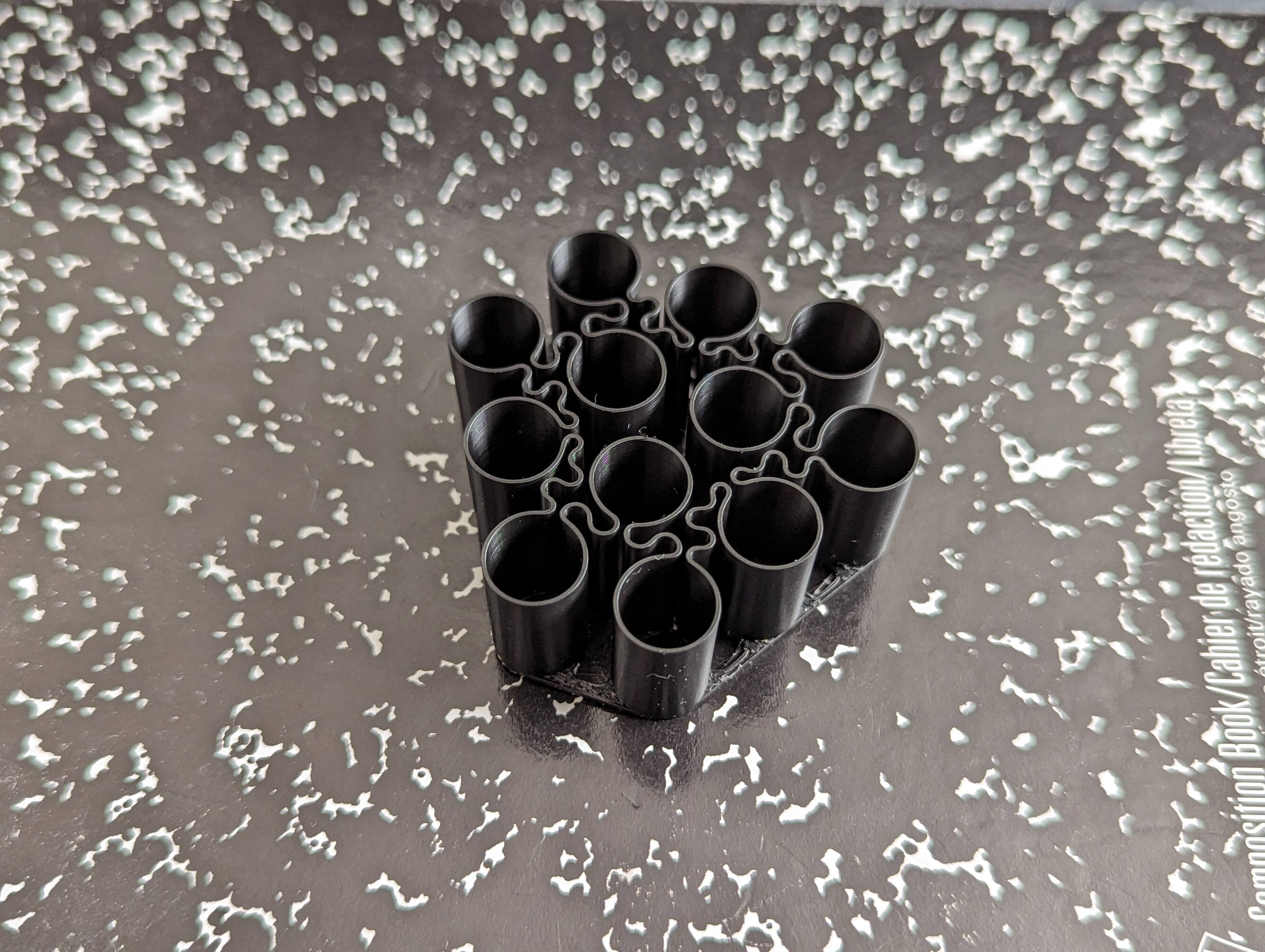 Giá Đựng Pin AAA In Chế Độ Xoắn Ốc