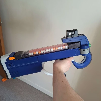 GnK-90: Súng Nerf Nạp Đạn Từ Trên, Chạy Bằng Solenoid, Động Cơ Không Chổi Than