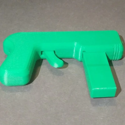 Tiny Toy Blaster V2 (Súng Đồ Chơi Airsoft 6mm) Không Keo, Không Ốc Vít: Chỉ Dây Thun và Bản In