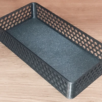 Hộp với các lỗ lục giác