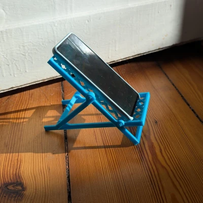 Giá đỡ điện thoại hình ghế xếp bãi biển