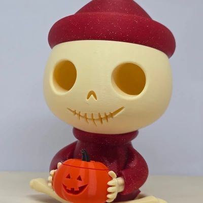 Bộ xương dễ thương ngồi với bí ngô (Trang trí Halloween)